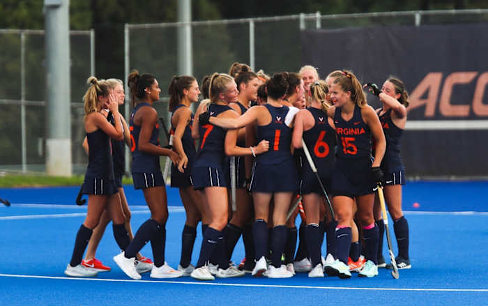 The Virginia field hockey team celebrates after defeating JMU.